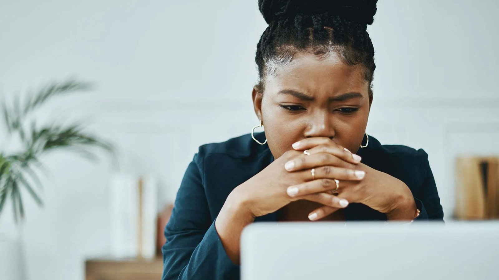 a lady looking at a laptop showing the Best Digital Evangelism Blogs in 2024